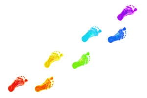 Baby foot prints all colors of the rainbow.